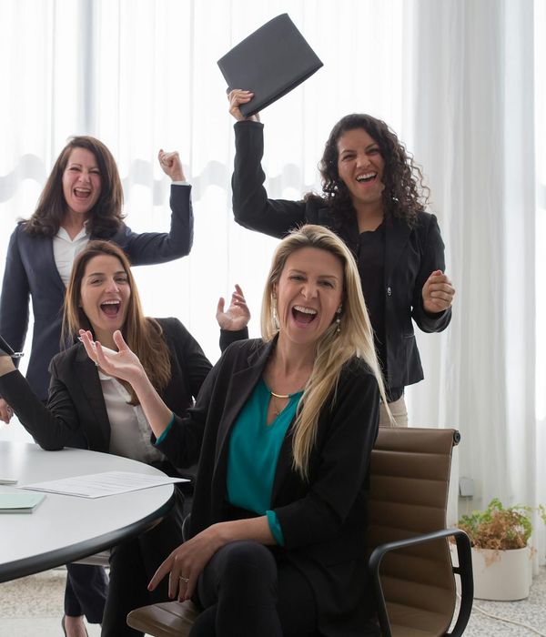 Trading team celebrating successful collaboration